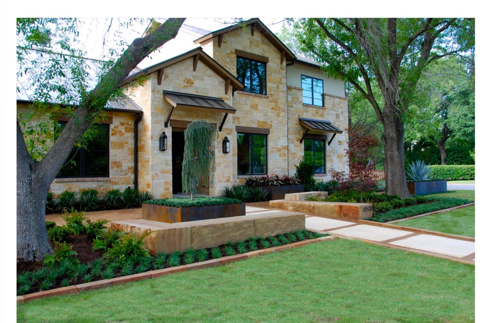 Modern Hill Country stone facade with custom Corten steel planters - luxury landscape design by Original Landscape Concepts in Preston Hollow, Dallas